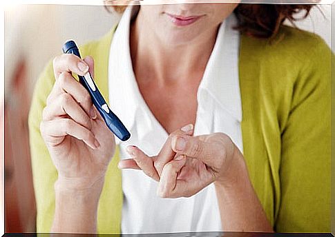 woman pricking herself for diabetes