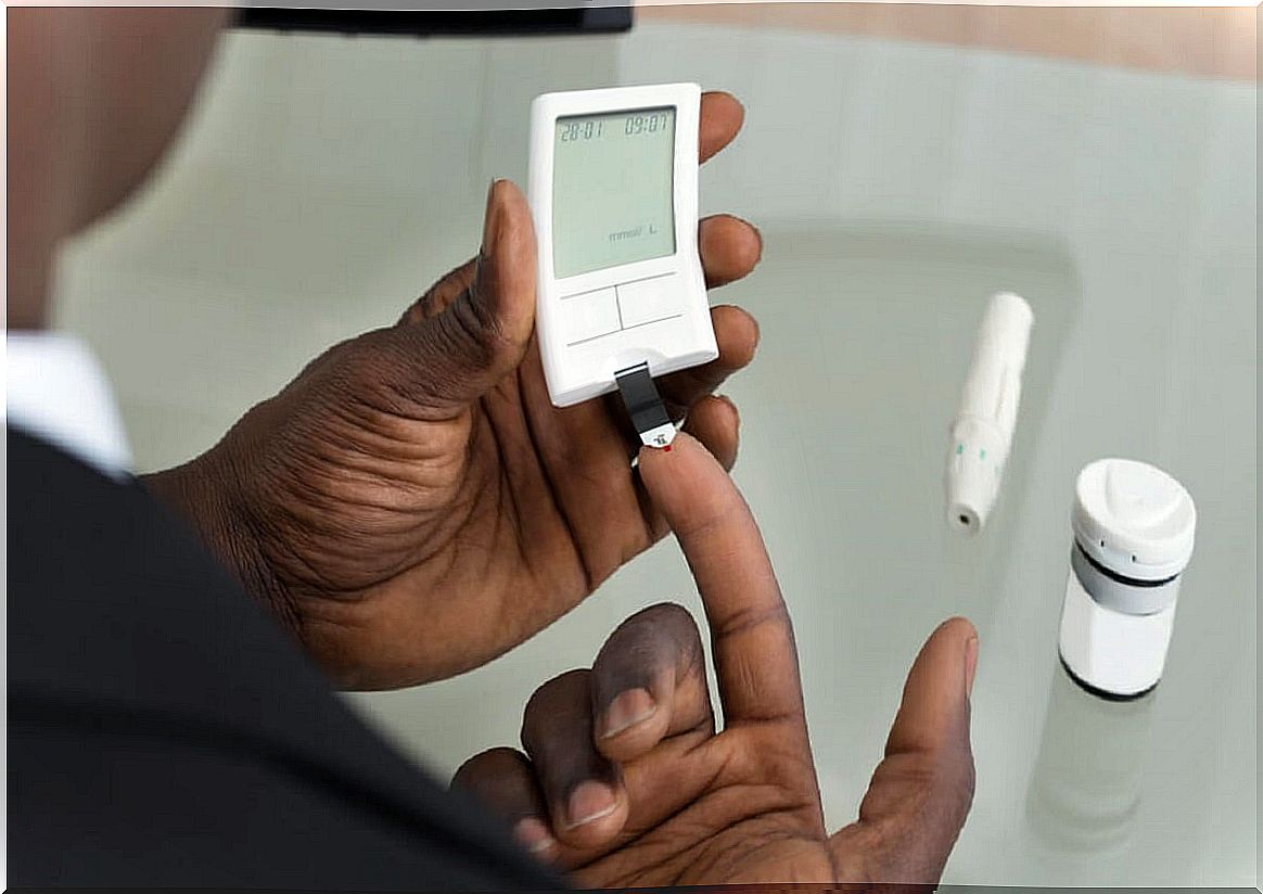 Diabetic patient measures his blood glucose.